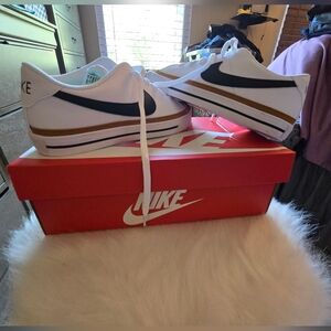 Nike size 10.5 canvas white, tan black